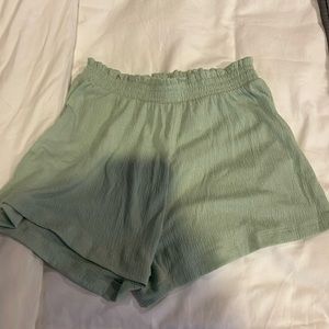 Like new pistachio colored gauzy shorts for girls size 11-12.